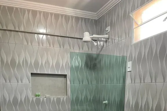 Banheiro em Pousada Villa Minduba